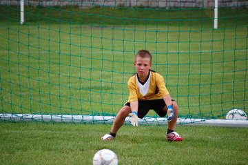 Picture of child playing soccer for post heel pain in kids